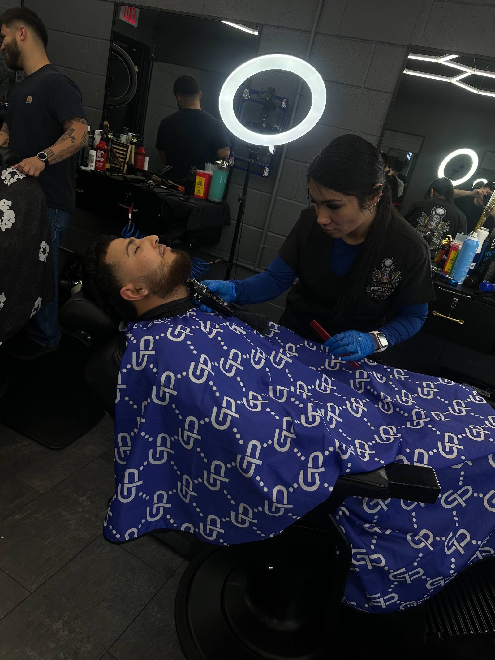 Student performing a beard line-up under instructor supervision