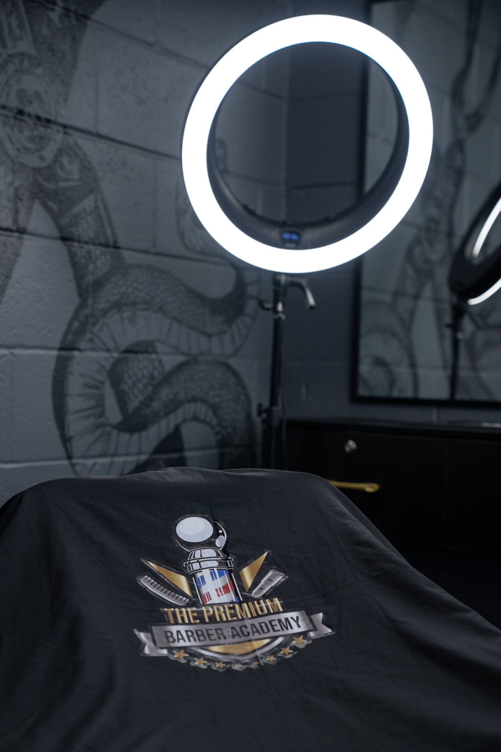Academy cape and ring light at the styling station