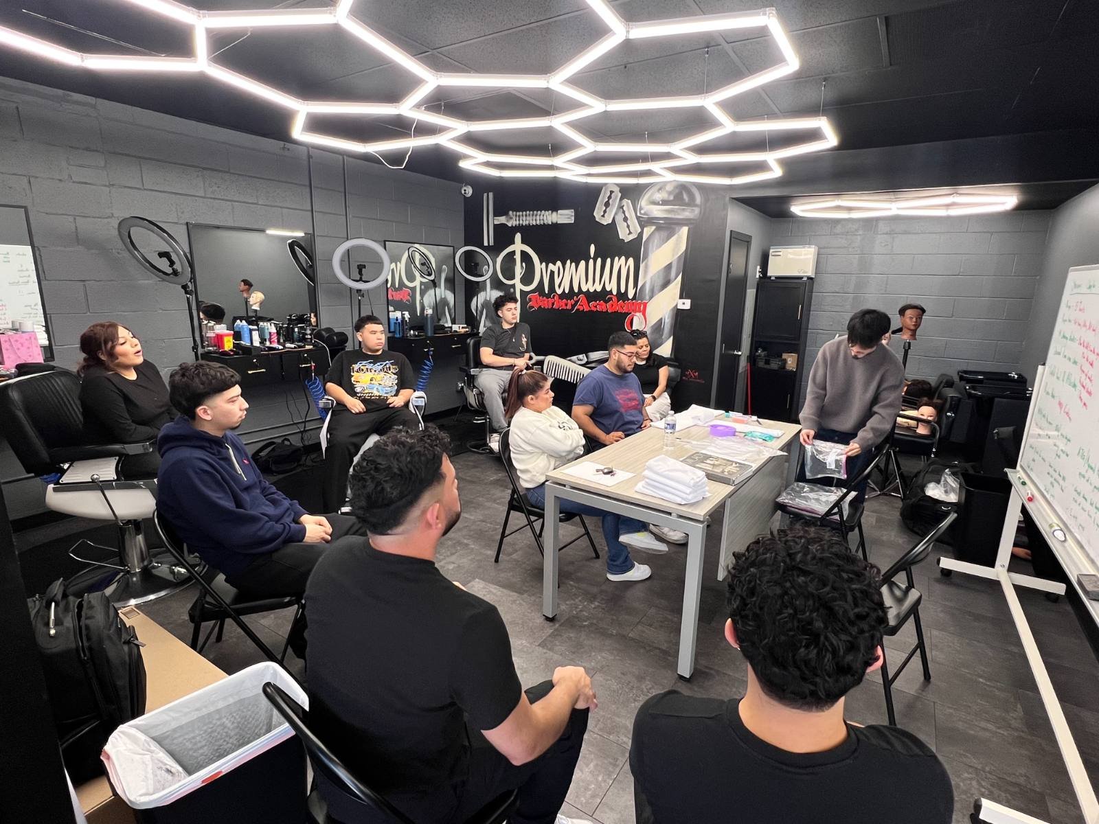 Students in a group instruction session on the academy floor